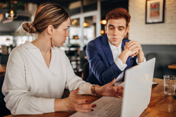istock Business people sitting in cafe 1393697524