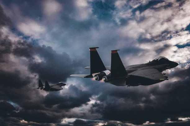 istock Jet fighters flying over the clouds. 1393697571