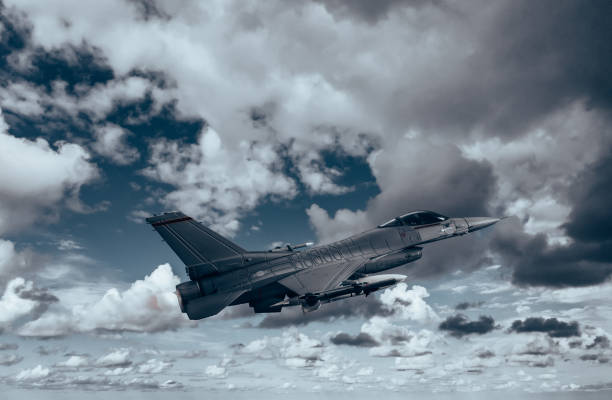 istock Jet fighters flying over the clouds. 1393697618
