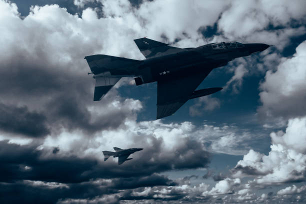 istock Jet fighters flying over the clouds. 1393697623