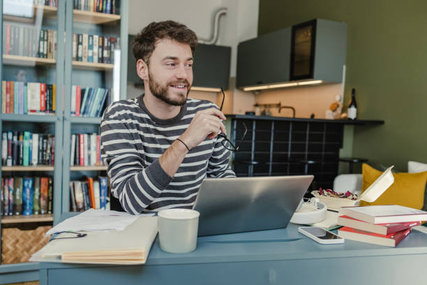 istock Working on laptop at home 1393698934