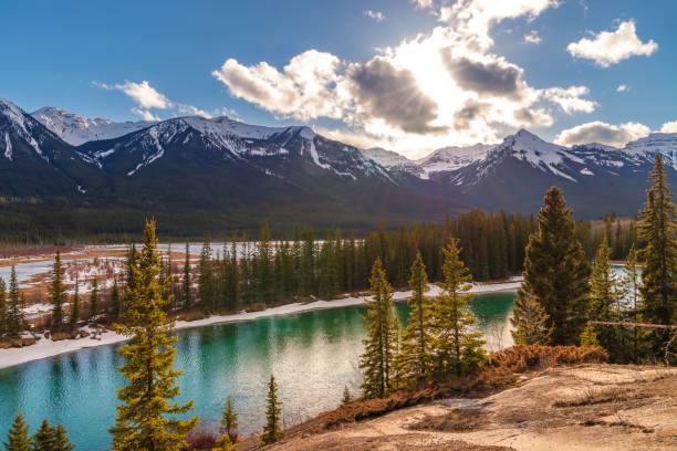 istock Sunny Clouds Over Banff Mountains And Bow River 1393707576