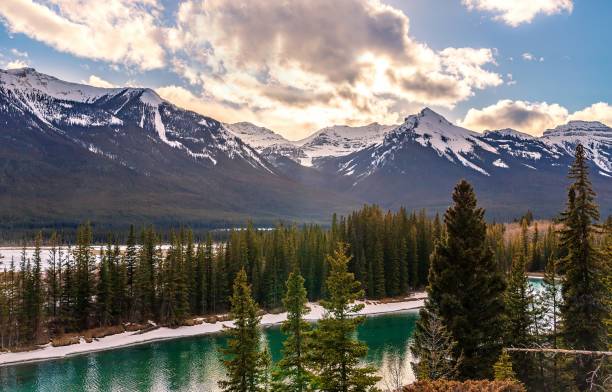 istock Sunshine Clouds Over Banff Mountains And River 1393707589