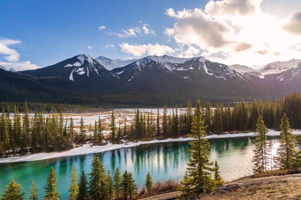 istock Sunny Clouds Over Banff Mountains And Bow River 1393707656