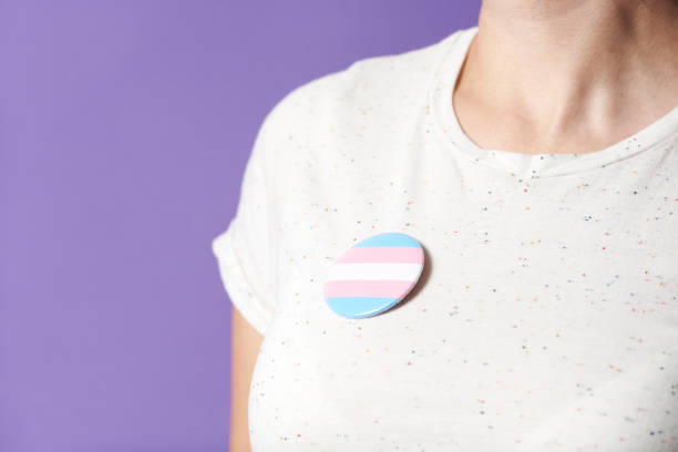 istock Unrecognizable person with a trans flag badge; gender diversity, identity pride 1393709282
