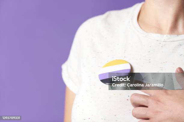 Person With A Non Binary Flag Badge Gender Diversity Identity Pride Stock Photo - Download Image Now