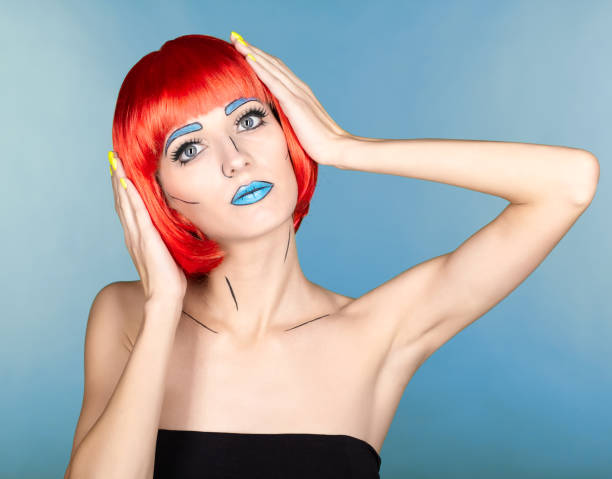 istock Female in red wig and in comic  pop art make-up style on blue background 1393714579