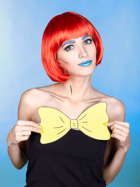 istock Female in red wig and in comic pop art make-up style on blue background 1393714597