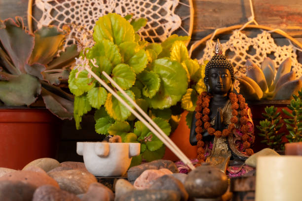 istock buddha statue image on altar with candles and plants 1393714622