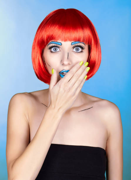 istock Female in red wig and in comic pop art make-up style on blue background 1393714627