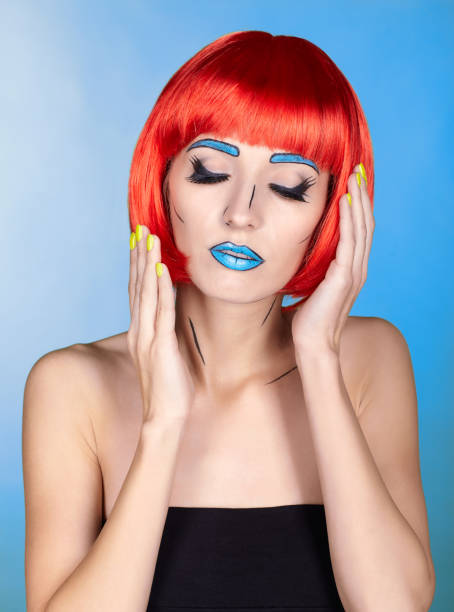 istock Female in red wig and in comic pop art make-up style on blue background 1393714632