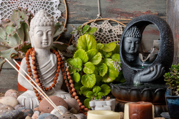istock buddha statue image on altar with candles and plants 1393714633
