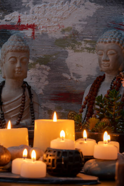 istock buddha statue image on altar with candles and plants 1393714678