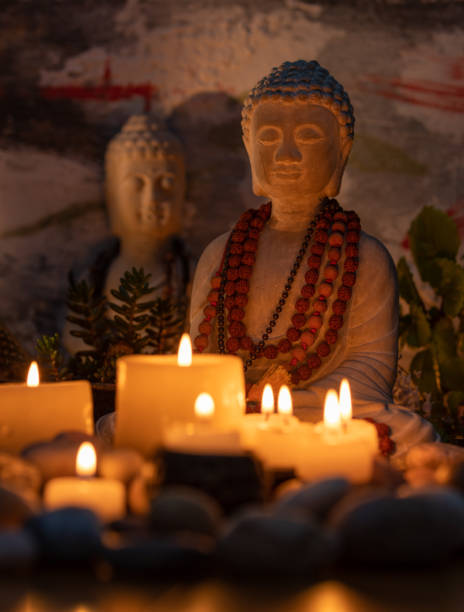 istock buddha statue image on altar with candles and plants 1393715219