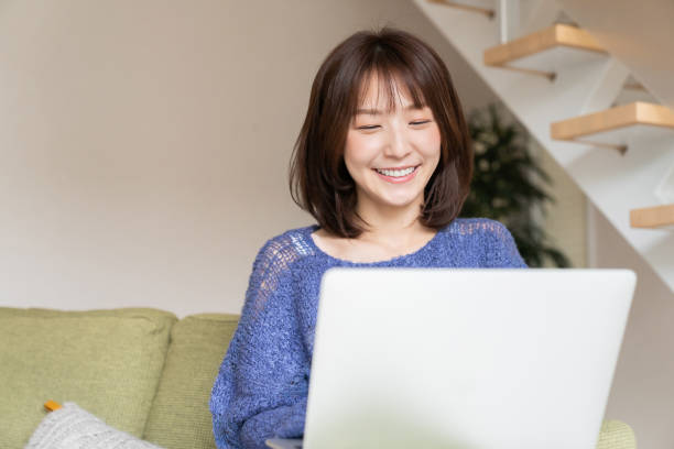 istock young asian woman using laptop 1393715331