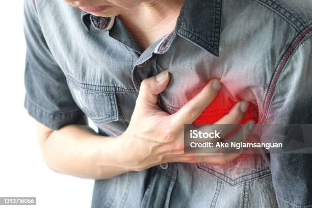 Man Is Sick And In Pain And Uses His Hands To Squeeze His Chest He Had Chest Pain Caused By An Acute Heart Attack Medical And Health Concepts Stock Photo - Download Image Now