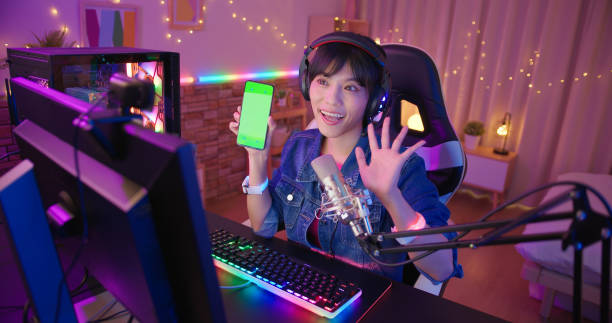 istock asian girl shows green screen 1393717820