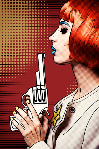 Portrait of young woman in comic pop art make-up style. Female with gun in hand.