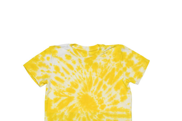 istock Yellow and white tie dye T-shirt isolated on a white background. Flat lay. 1393722105