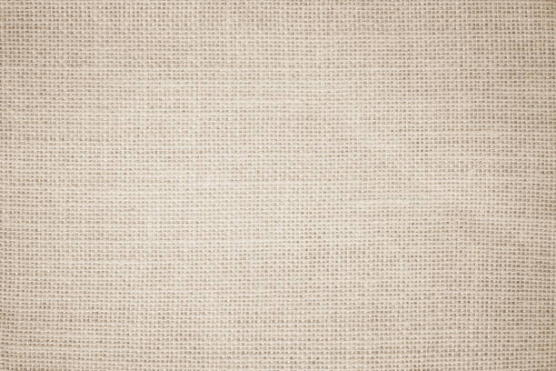 istock Jute hessian sackcloth burlap canvas woven texture background pattern in light beige cream brown color blank. Natural weaving fiber linen and cotton cloth texture as clean empty for decoration. 1393725172