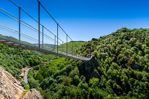 Hautpoul footbridge over the Arnette valley close to Mazamet city in France