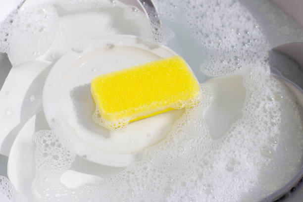 istock Dish washing, Dirty dishes soaking in kitchen sink. 1393729796