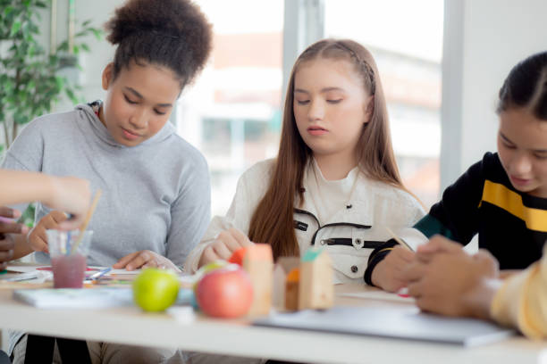 istock Group of student sitting and studying and learning drawing with teacher together in classroom at the school, pupils creativity and development for drawing in course, back to school, education concept. 1393729800