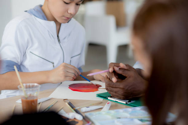 istock Group of student sitting and studying and learning drawing with teacher together in classroom at the school, pupils creativity and development for drawing in course, back to school, education concept. 1393729819