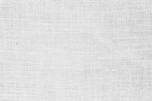 istock White fabric jute hessian sackcloth canvas woven gauze texture pattern in light white color blank. Natural linen and cotton cloth texture as clean background empty for decoration. 1393733336