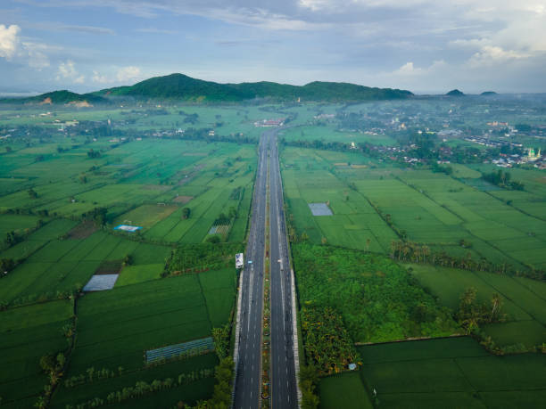 istock Lombok bypass road aerial view 1393735292