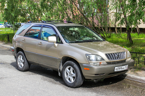 Novyy Urengoy, Russia - June 26, 2020: Old Japanese crossover Lexus RX300 in a city street.