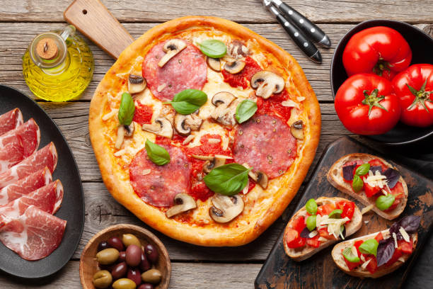 istock Italian cuisine. Pizza and toasts 1393739746