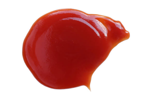 istock Red ketchup isolated on white background with clipping path. tomato sauce texture. from above. 1393741393