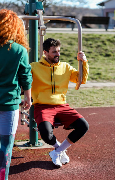 istock Sporty man exhausted from exercising outside with personal trainer 1393749438