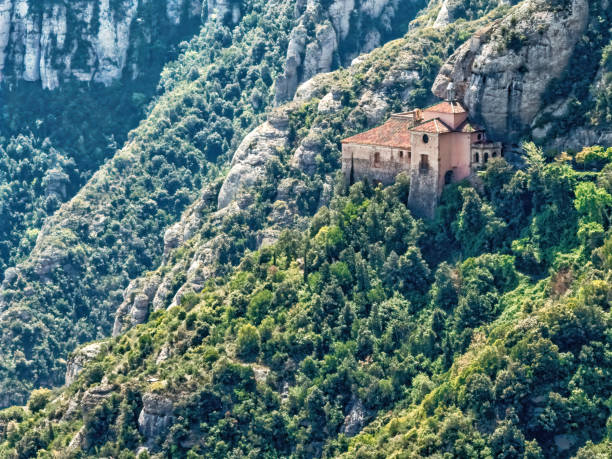 Montserrat is a mountain near Barcelona, in Catalonia. View of the chapel of Santa Cova stock photo