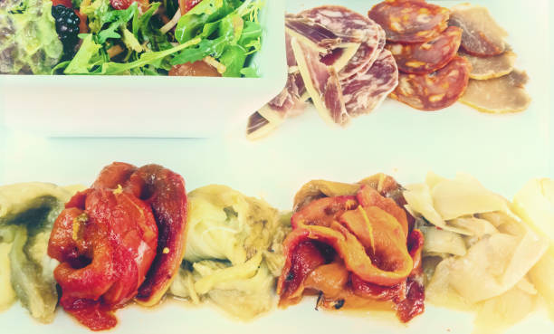 istock Spanish Tapas with mixed meats salad and grilled vegetables. 1393750516