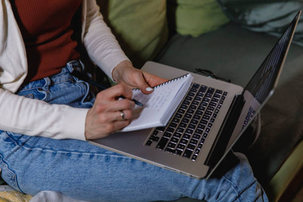 istock Woman attending educational webinar and writing notes 1393750624