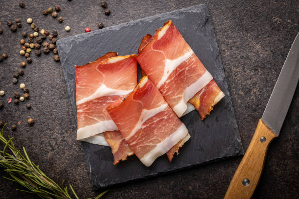 istock Sliced schwarzwald ham. Dried prosciutto ham. 1393751381