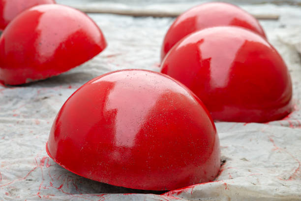 istock Red concrete parking barriers in the form of hemispheres. 1393752053