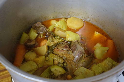 Spicy broth cooked with various vegetables and lamb meat to serve couscous  Middle Eastern cuisine