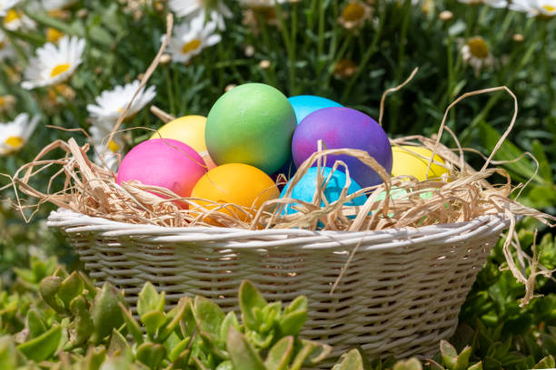 istock Colorful Easter Eggs in cute basket, side view 1393753274