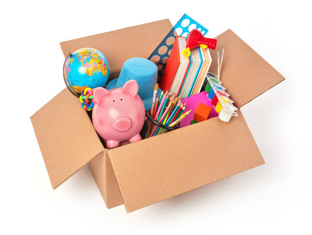 Cardboard box full with kid's toys stock photo