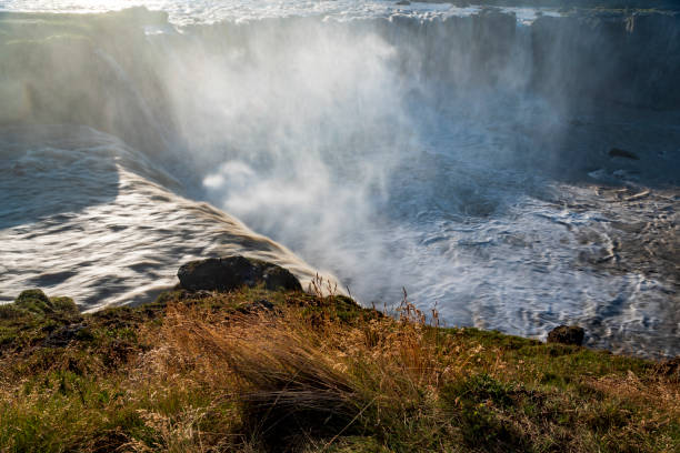 istock dramatic sky during sunset in the powerful Godafoss waterfall in Iceland 1393755001
