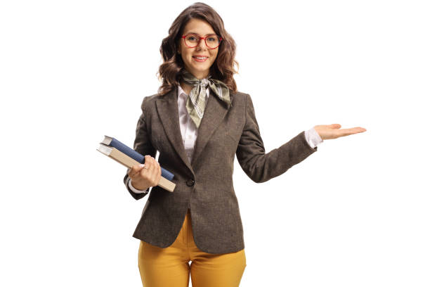 Young female teacher holding something imaginary with one hand isolated on hite background