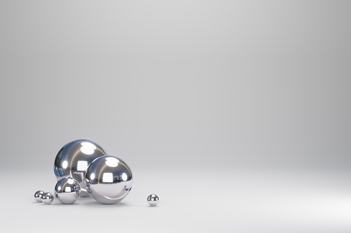 Metallic spheres on grey background, 3d render