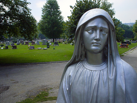 Statue of a crying Virgin Mary at St. Mary's Cemetery in Port Washington, WI.