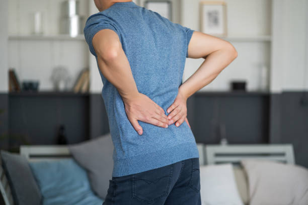 istock Back pain, kidney inflammation, man suffering from backache at home 1393757721