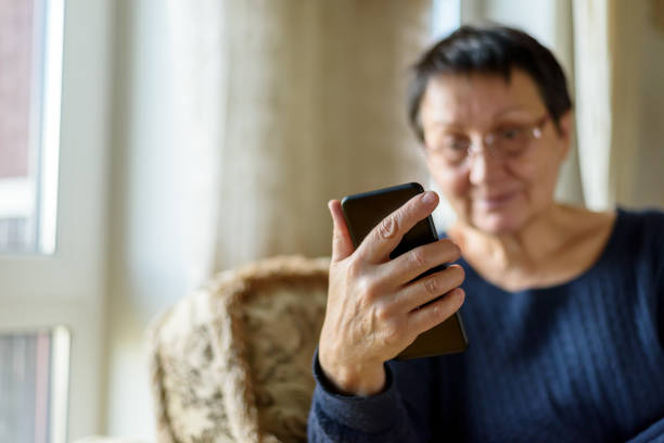 istock Senior woman using smartphone 1393759771