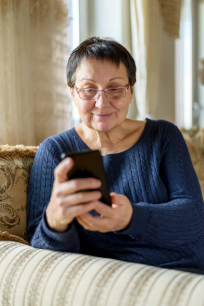 istock Senior woman using smartphone 1393760713