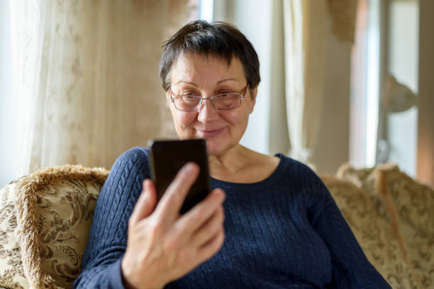 istock Senior woman using smartphone 1393761399